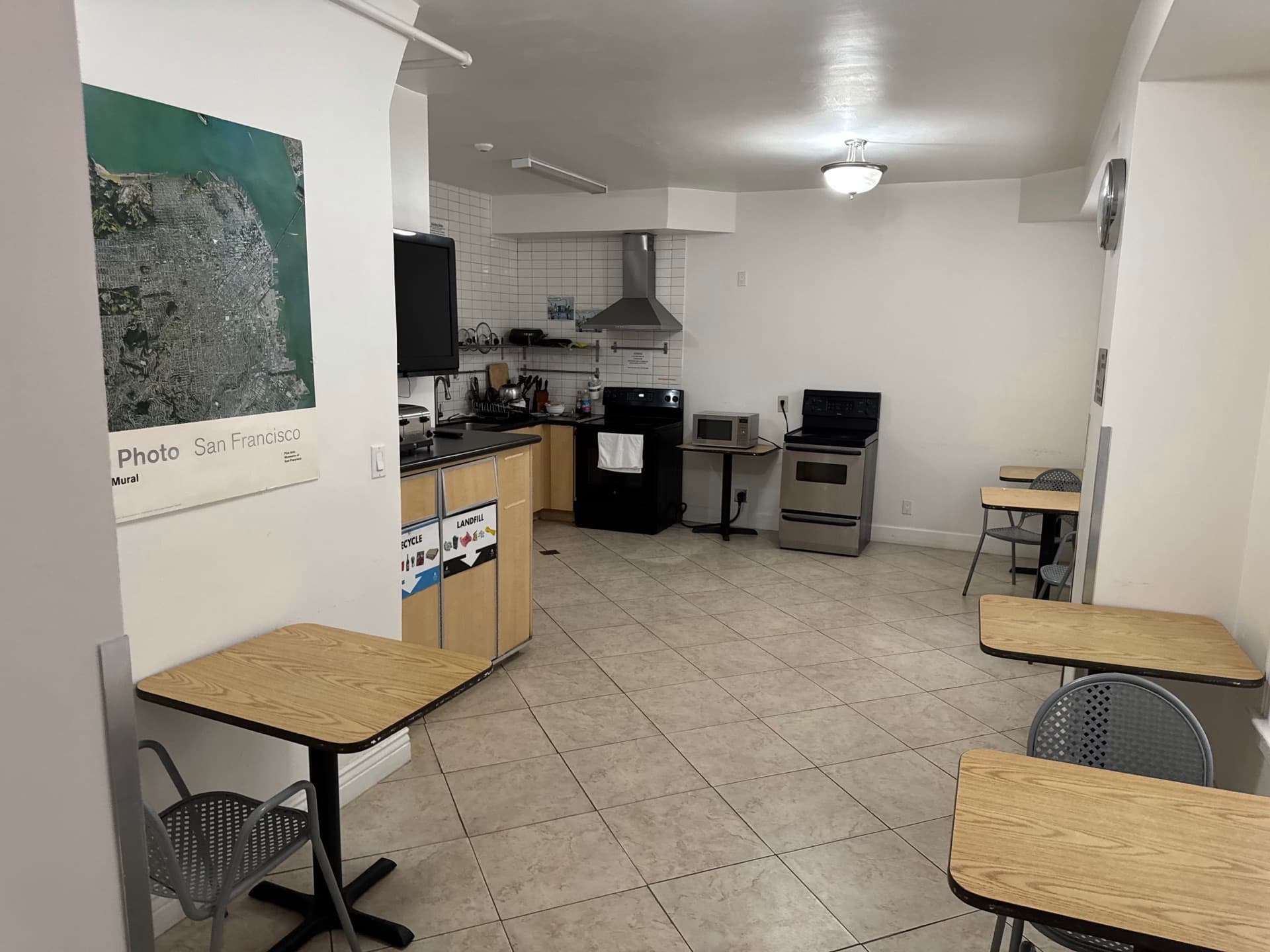 Shared kitchen dining area with tables and chairs